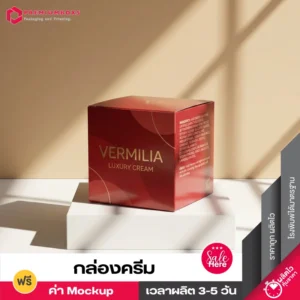 กล่องครีม VERMILIA สีแดงปั๊มฟอยล์ทอง วางบนแท่นขาวรับแสงเงา
